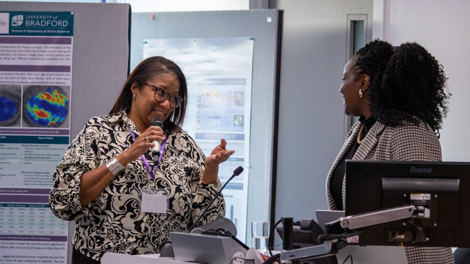 Marsha de Cordova speaks with a delegate at the Women in Vision UK annual general meeting at City St George’s, University of London