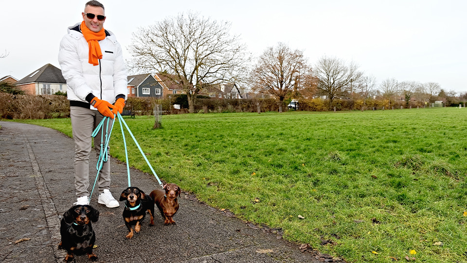 Neil Retallic walks his dogs in the park