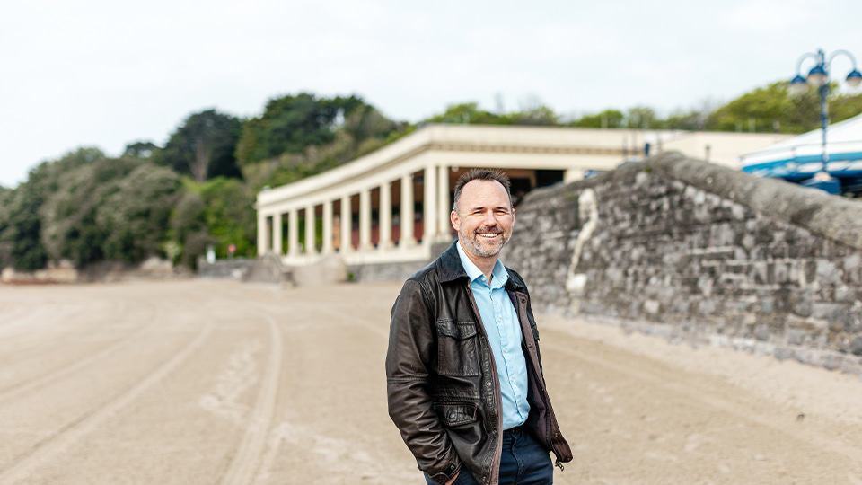 A beach on Barry Island featured as a backdrop to the photoshoot with Dr Adrian Jones