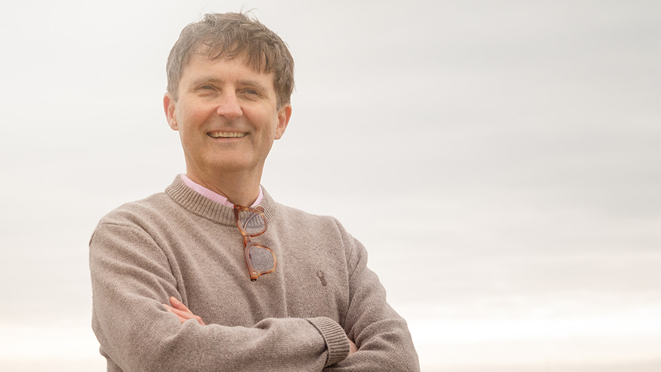 David Cummins with the beach in the background