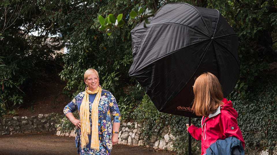 Michaela Leitso takes part in an outdoor element of the photoshoot, with Thompsons Optician dispensing optician and practice manager, Sarah Sobey, kindly assisting with lighting