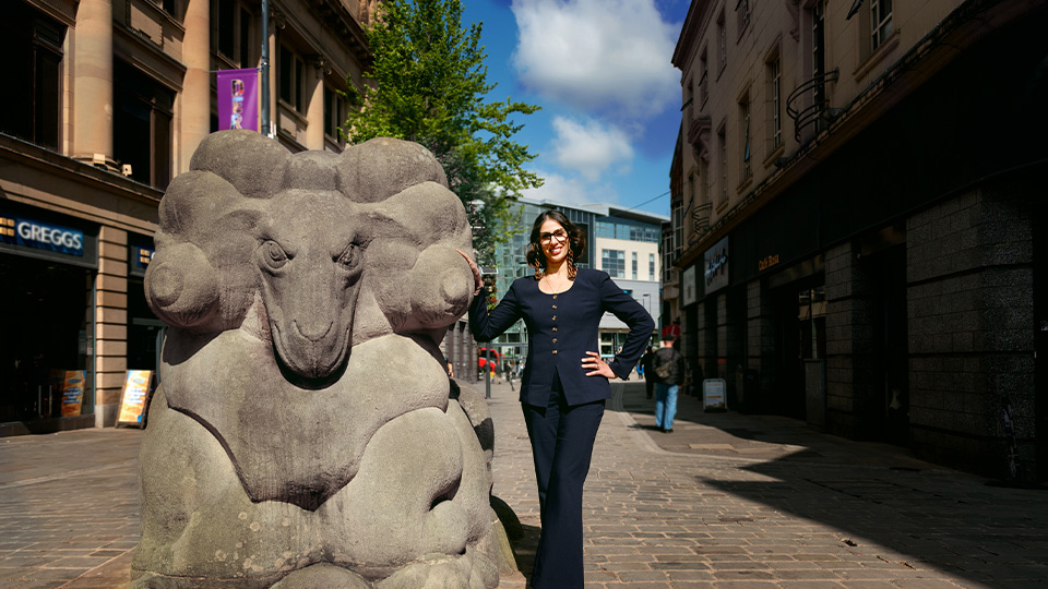 Optometrist, Davina Dosanjh, with Derby’s iconic Derby Ram sculpture