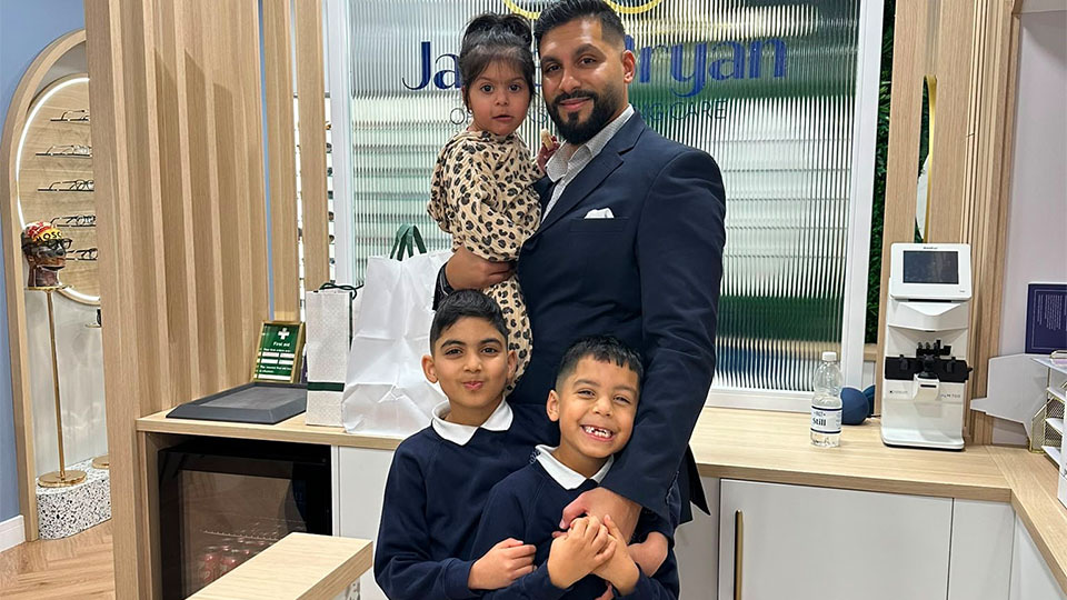 Zahir-Ally Kanji with his children, holding his daughter