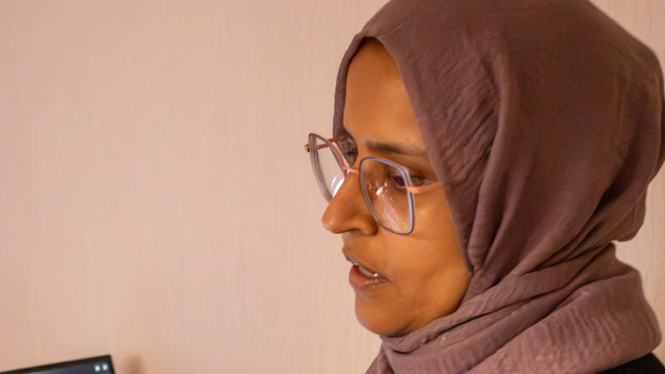 Fatema clicking through images on a screen and discussing
