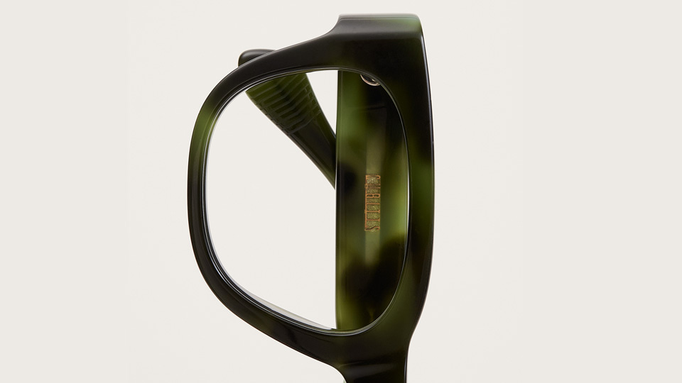 Green and black Cubitts frame called, Kember