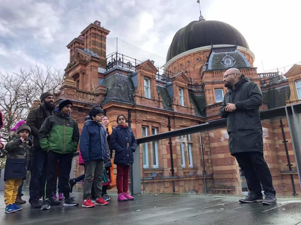 Imad Ahmed speaks to a group