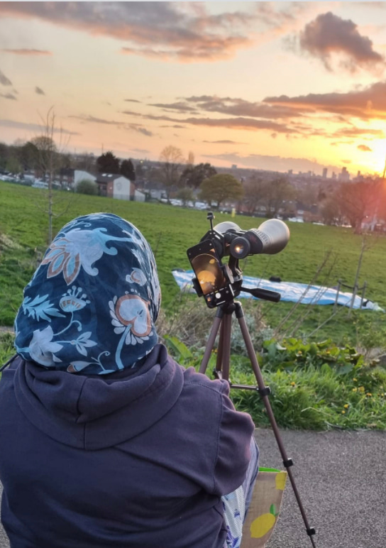 person sitting in front of a camera 