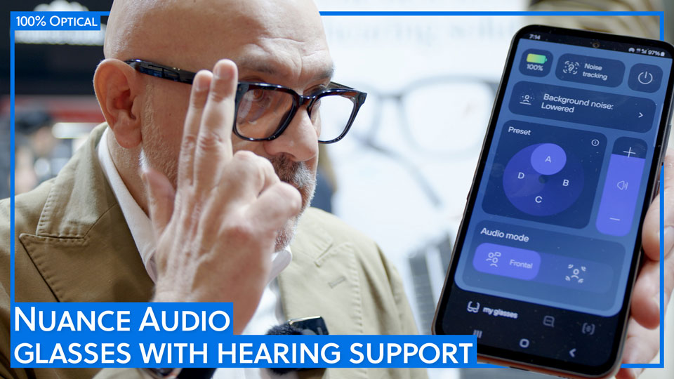 Raffaello Infantino taps two fingers two the arm of his glasses to change the settings of his pair of Nuance Audio. To the right of the frame is a cut-out of a smartphone displaying the settings of the Nuance Audio app