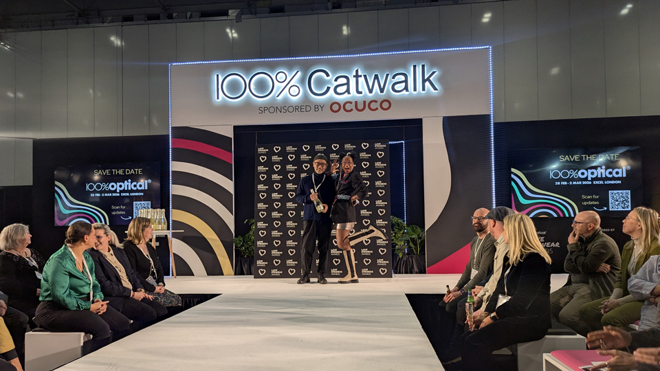 Love Eyewear Awards on a catwalk stage. Two people standing side by side on the stage