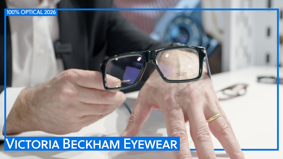 Close up of hands holding a bold black squared frame with strong brow line from Victoria Beckham’s collection