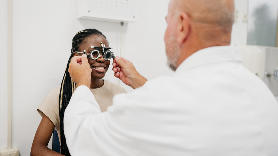 A female patient in the eye test room 