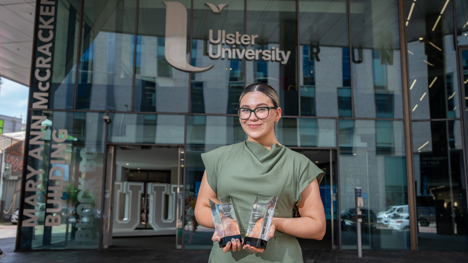 Caitlin Campbell with her Three Minute Thesis competition award