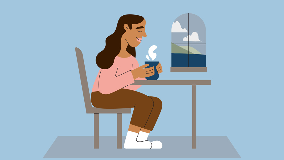 Young cartoon woman wearing pale pinks and browns drinks a cup of warm steaming tea from a navy mug by a window – through which are a navy ocean, green hills, and white clouds