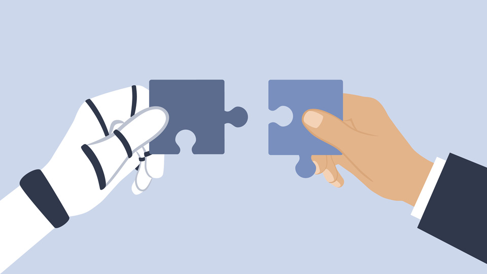 Robot hand and human hand each holding a puzzle piece 