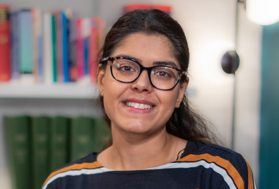 Roshni smiles in the AOP library