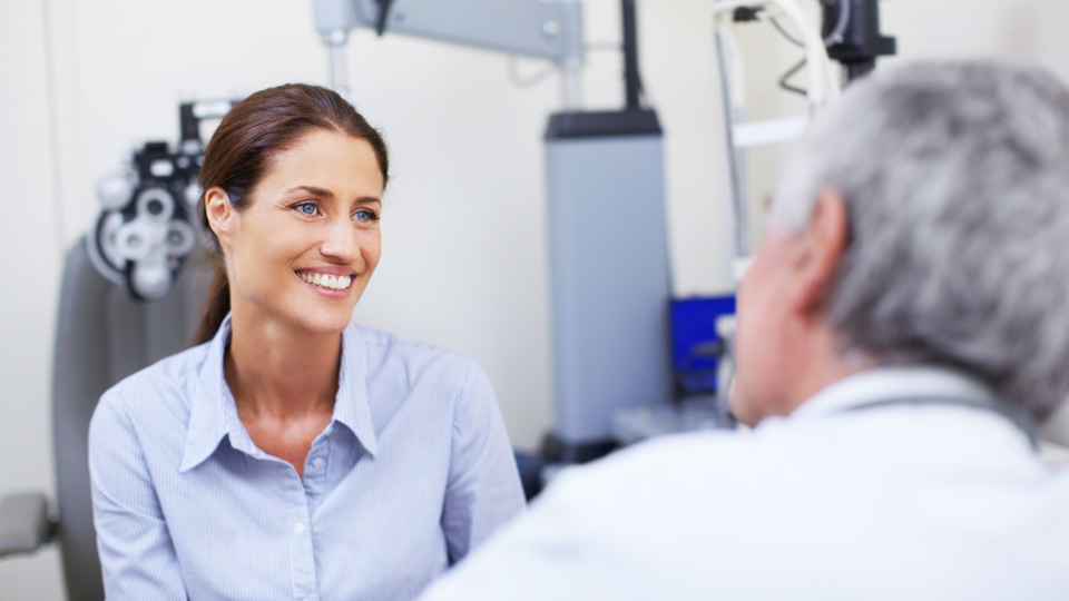 Optician talking to a patient 