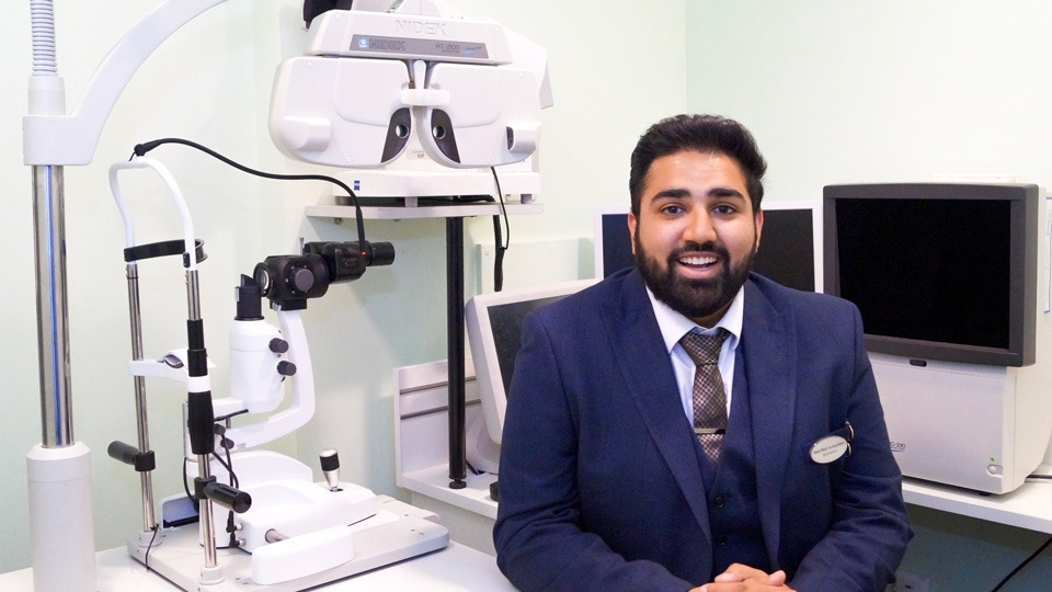 Hamza is photographed in a clinic room in his practice