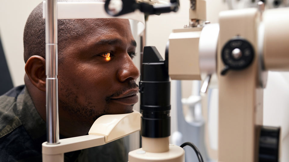 Male patient in practice having a eye exam