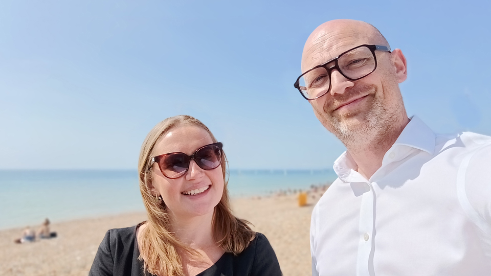 Dave Cleworth and Sarah Watters are shown at the beach