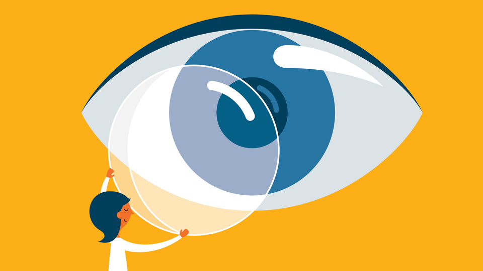 Illustration of an eye with a person holding a contact lens