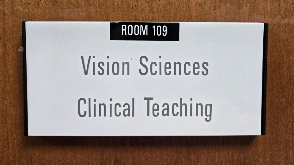 The sign on the door of the Aston University optometry department 109 clinic