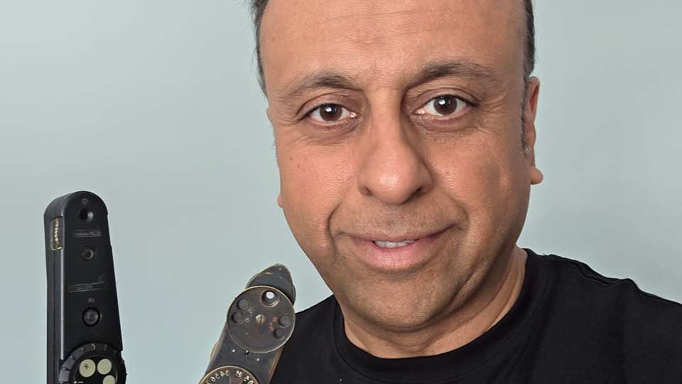 Professor Shehzad Naroo with an ophthalmoscope