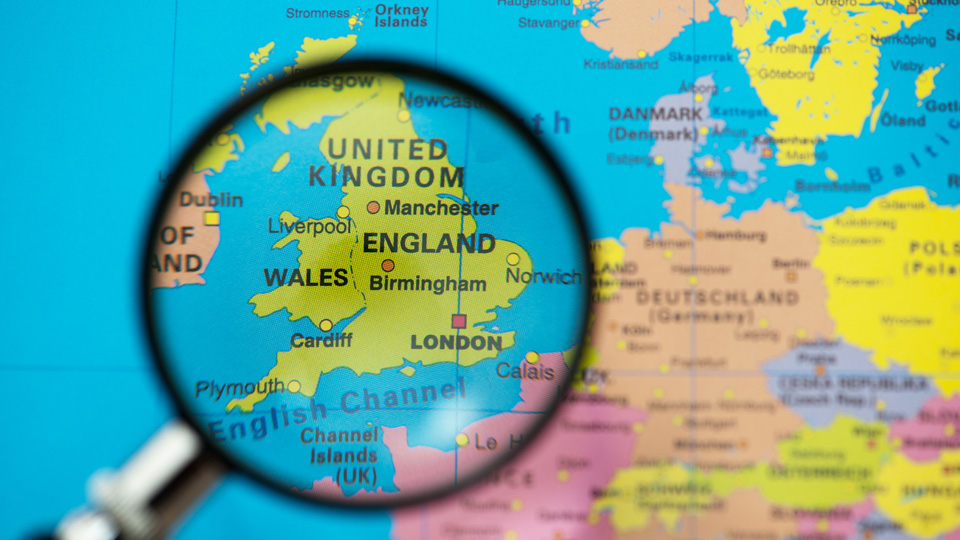 A map if the United Kingdom under a magnifying glass