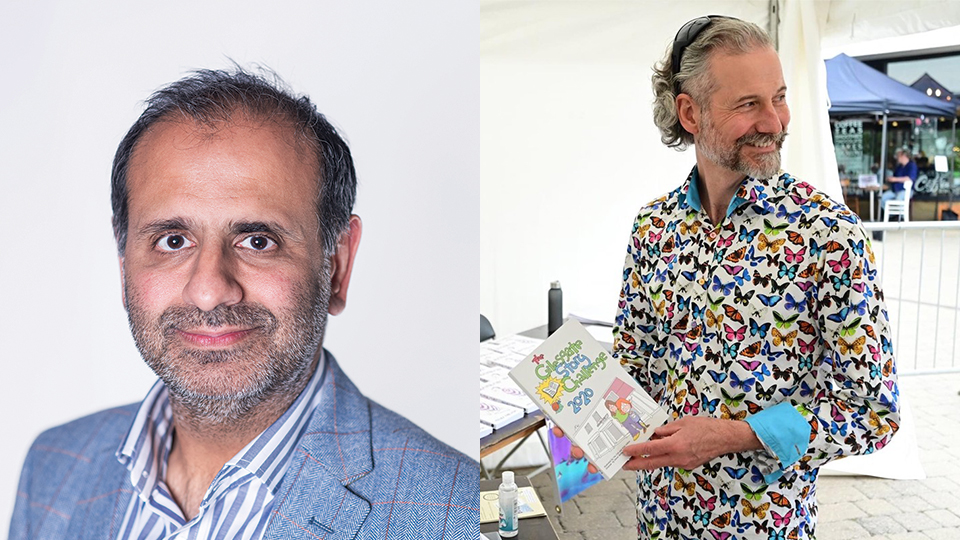 Composite image of two men. On the left, a close-up headshot of a middle-aged man with short dark hair and light stubble, wearing a blue blazer over a striped shirt against a plain light background. On the right, a grey-haired man with a beard, wearing a colourful butterfly-print shirt, stands at a stall holding a booklet, with papers and a hand sanitiser bottle on the table beside him