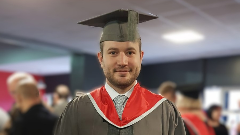 Richard Spencer graduating as a dispensing optician