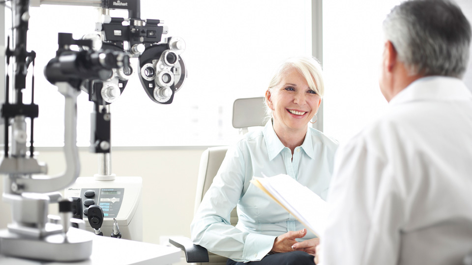 A lady sitting listening to her optometrist