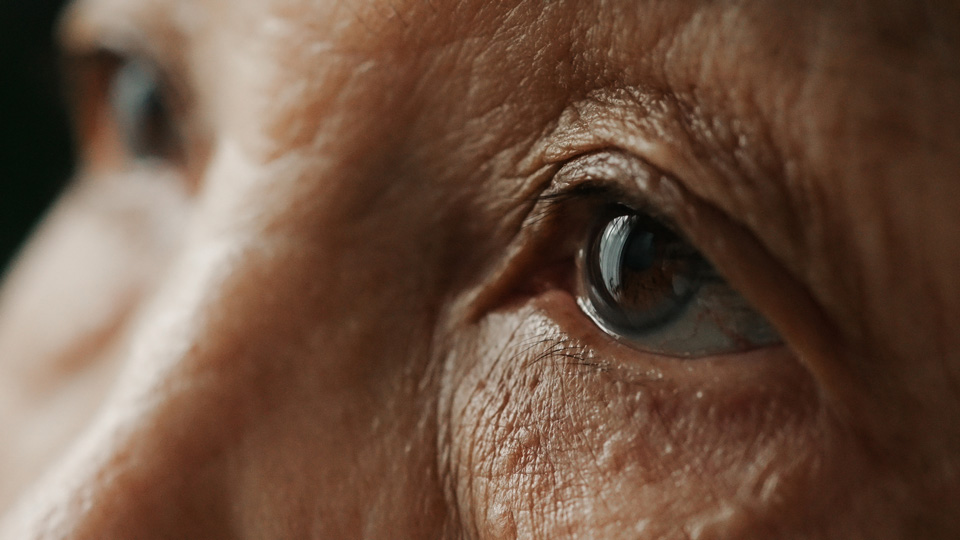 A close up of an older woman’s eye