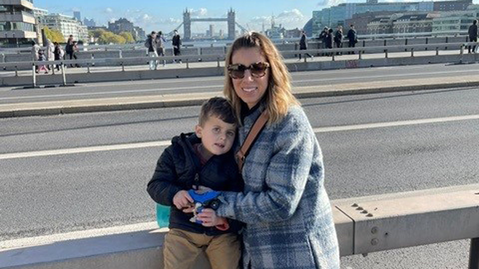 DJ and Dace stand on a bridge in London