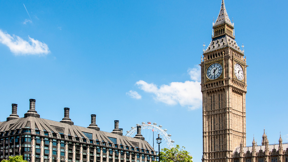 Portcullis house, Houses of Parliament and Big Ben , with the London Eye in the background, on a sunny day