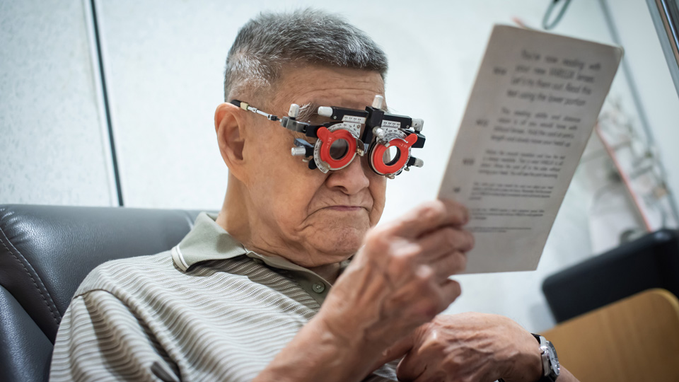 An older man receives a sight test