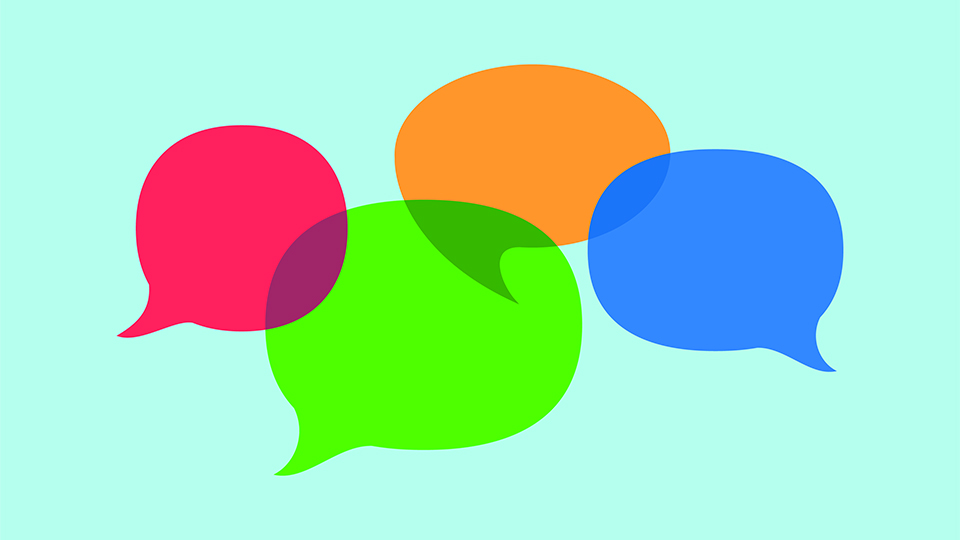 Four speech bubbles in red, green, yellow, and blue, overlap and intersect over a light blue background