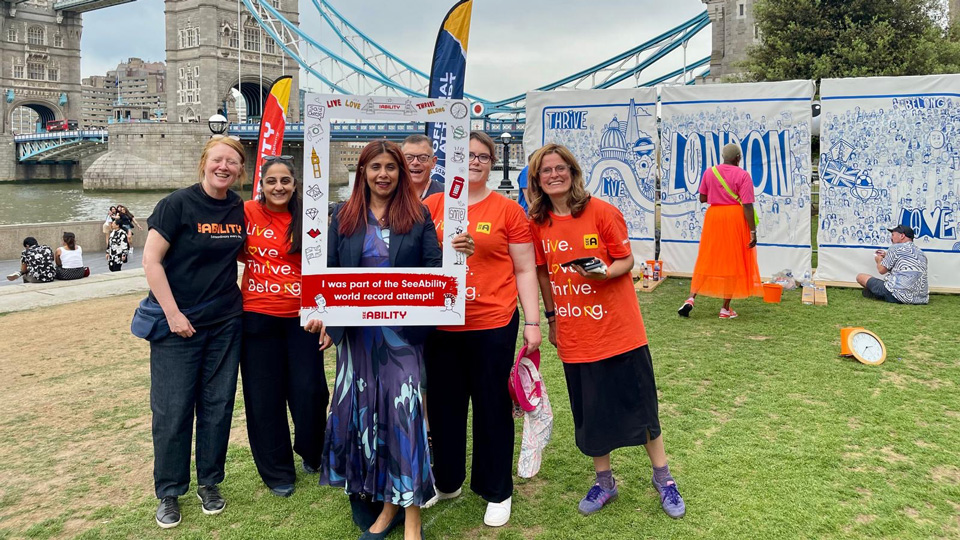 Marina Ahmad AM, centre, with Grace McGill and SeeAbility colleagues during the charity's successful Guinness World Record Attempt at Potter's Fields in May 2026