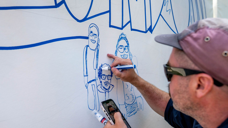Alex the Doodler illustrating Terence into the Guinness World Records attempt mural