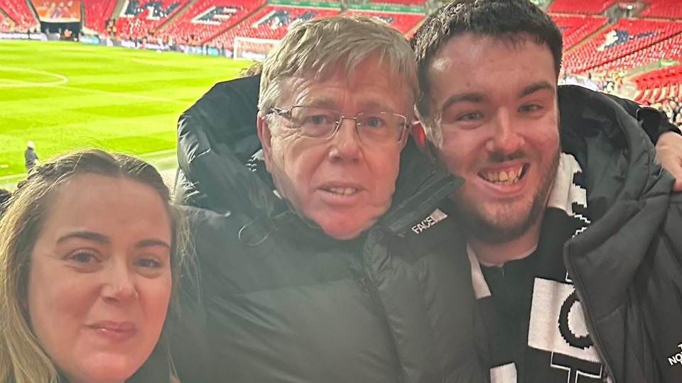 Moorfields Eye Hospital patient, Jake Ternent, on right, with his family at Wembley Stadium