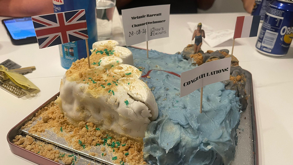 A cake depicting the White Cliffs of Dover made for Melanie Barratt to celebrate swimming the English Channel