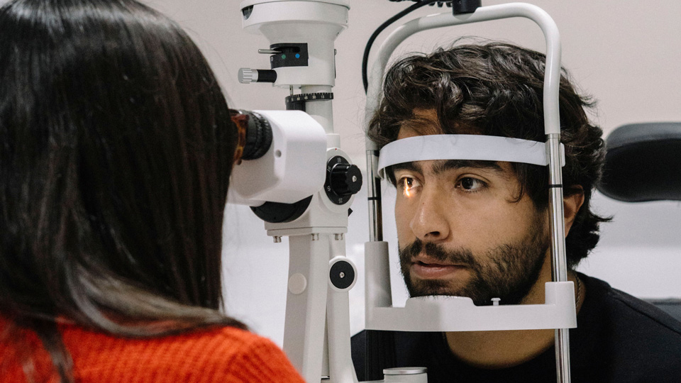 A young man is having a sight test