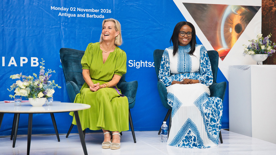 HRH shares the podium with Lucia Mvula, Country Director, Orbis Zambia