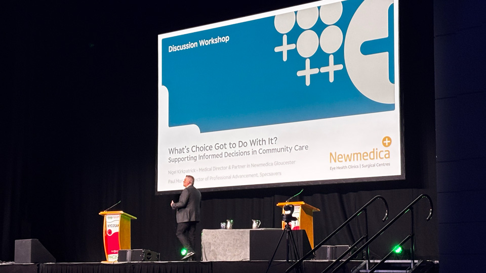 Paul Morris on stage begins a session on informed choice