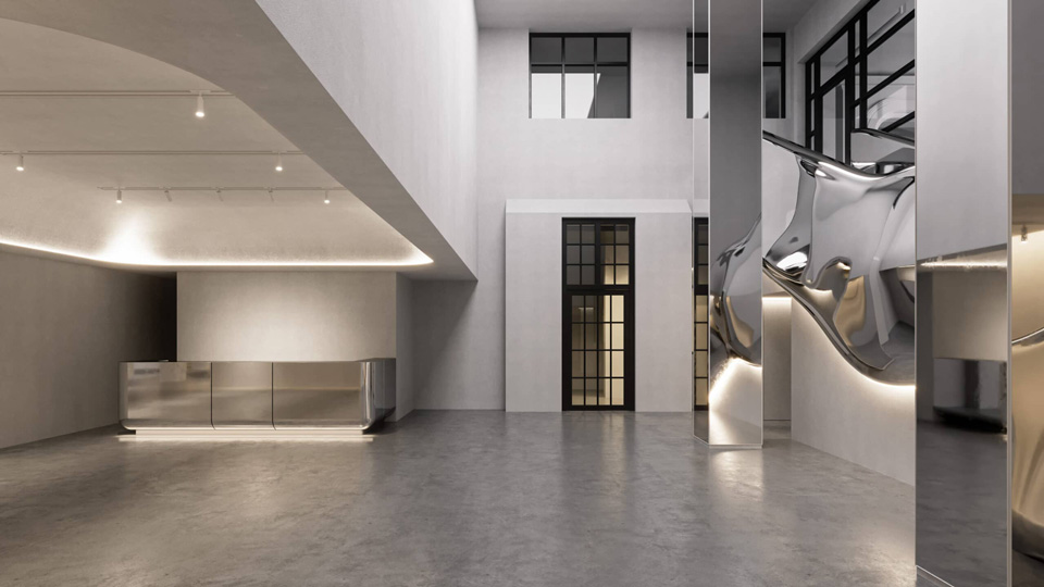 A modern white gallery space with curving metal structures