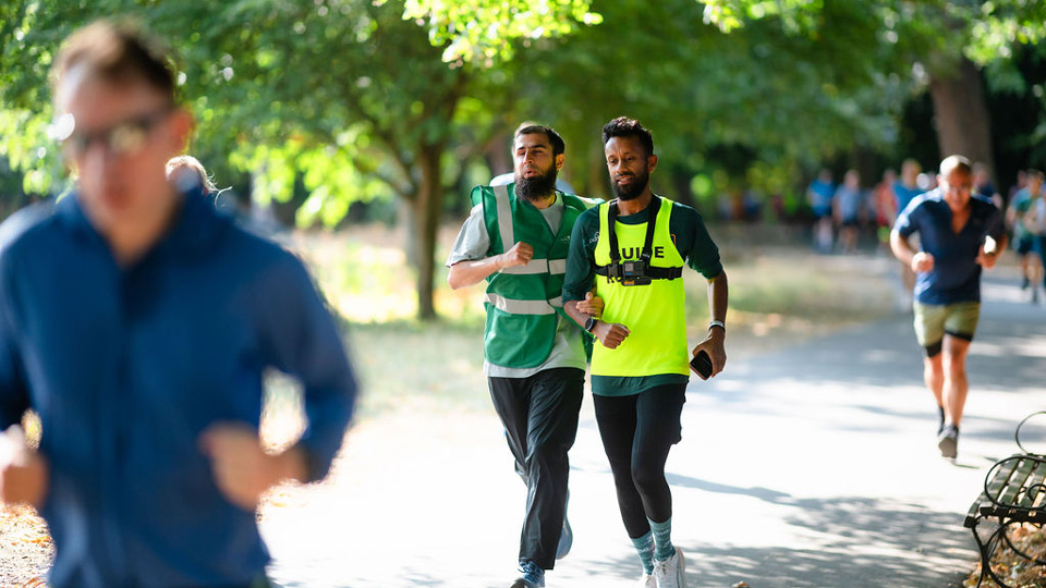 Two men, one a guide runner, take part in Parkrun