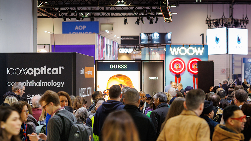 A bustling exhbition hall at 100% Optical