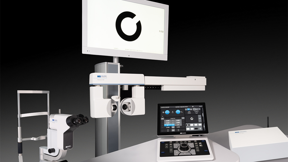 A slit lamp and digital phoropter positioned side by side on a table  