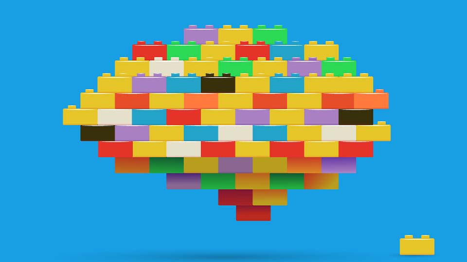 Colouful Lego building blocks on a sky blue background  