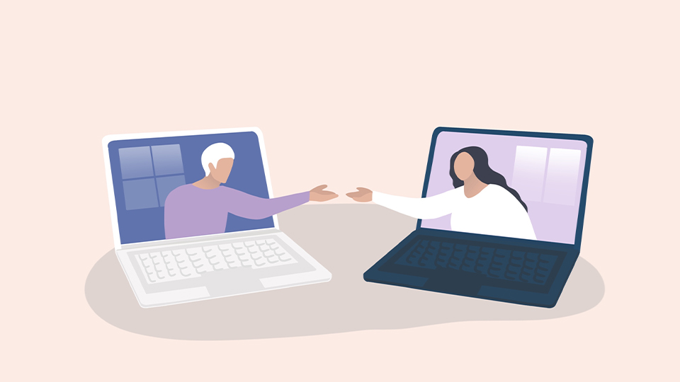 Two cartoon laptops are placed on a table and cartoon women are stretching out to touch hands from inside the screen  