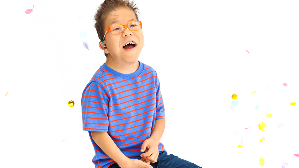 Children wear colourful clothes and frames