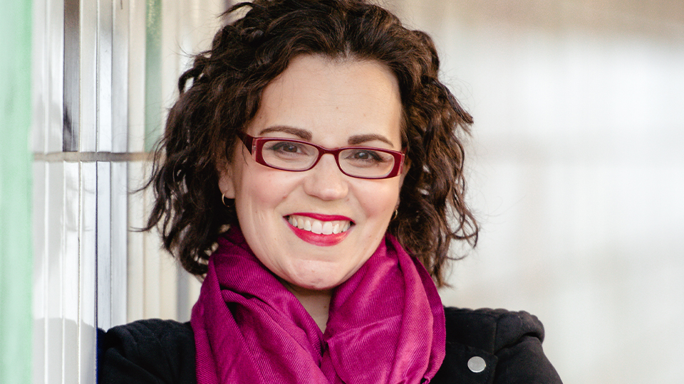 Dr Philippa Kaye wears rectangular purple spectacles